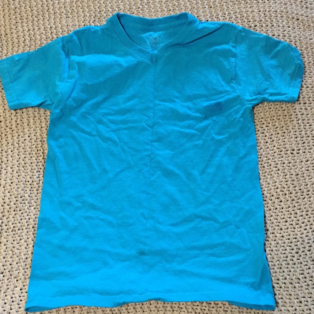 Unisex shirt, size 6/7, blue, stains shown.